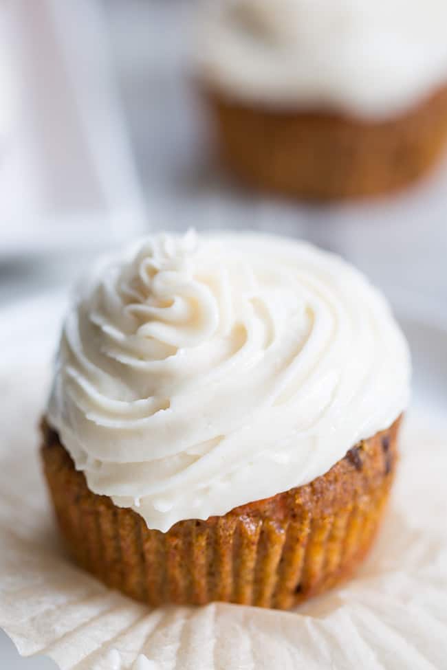 These dreamy carrot cake cupcakes are made with coconut and tapioca flour and sweetened with maple syrup, making them both paleo and nut free.   They're topped with a sweet creamy paleo vanilla "buttercream" that tastes just like real thing! 