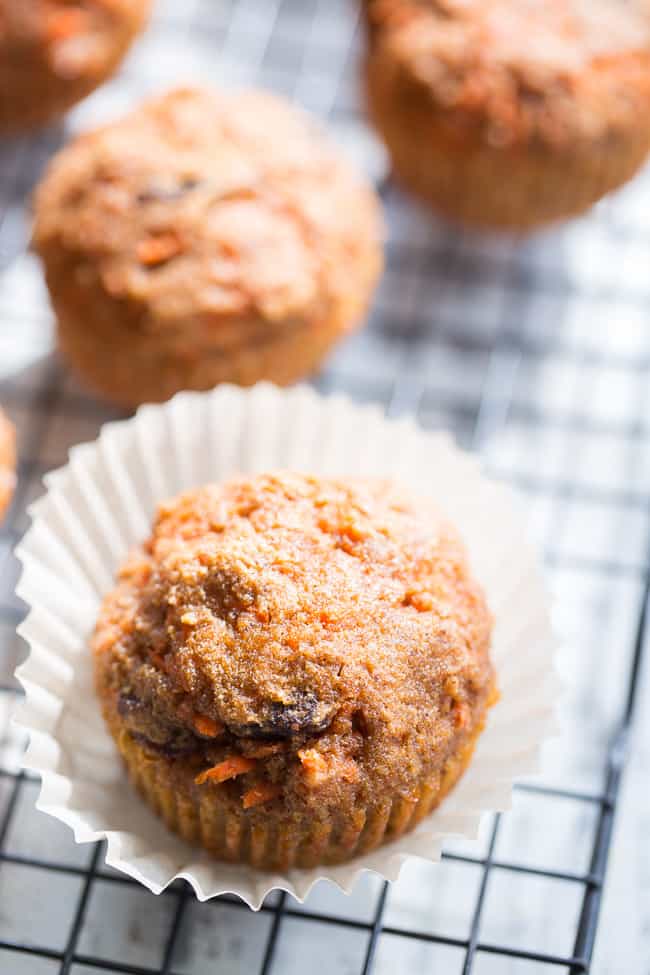 These dreamy carrot cake cupcakes are made with coconut and tapioca flour and sweetened with maple syrup, making them both paleo and nut free.   They're topped with a sweet creamy paleo vanilla "buttercream" that tastes just like real thing! 