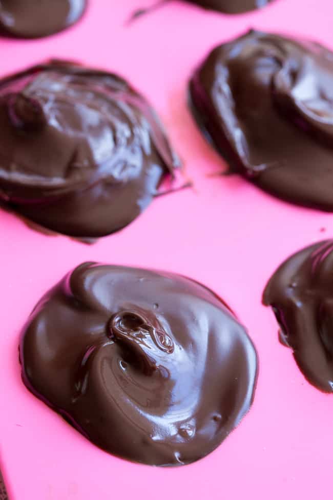 These homemade copycat Cadbury Creme Eggs are a rich and decadent paleo chocolate treat that everyone will love!  Easy to make - the filling comes together in just a few minutes and contains no nuts or refined sugar, and has a dairy free option. 