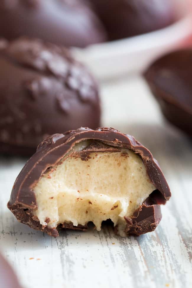 These homemade copycat Cadbury Creme Eggs are a rich and decadent paleo chocolate treat that everyone will love!  Easy to make - the filling comes together in just a few minutes and contains no nuts or refined sugar, and has a dairy free option. 