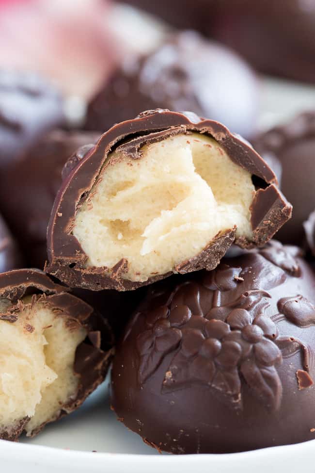 These homemade copycat Cadbury Creme Eggs are a rich and decadent paleo chocolate treat that everyone will love!  Easy to make - the filling comes together in just a few minutes and contains no nuts or refined sugar, and has a dairy free option. 