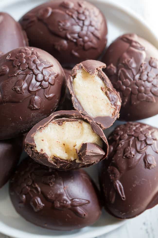 These homemade copycat Cadbury Creme Eggs are a rich and decadent paleo chocolate treat that everyone will love!  Easy to make - the filling comes together in just a few minutes and contains no nuts or refined sugar, and has a dairy free option. 