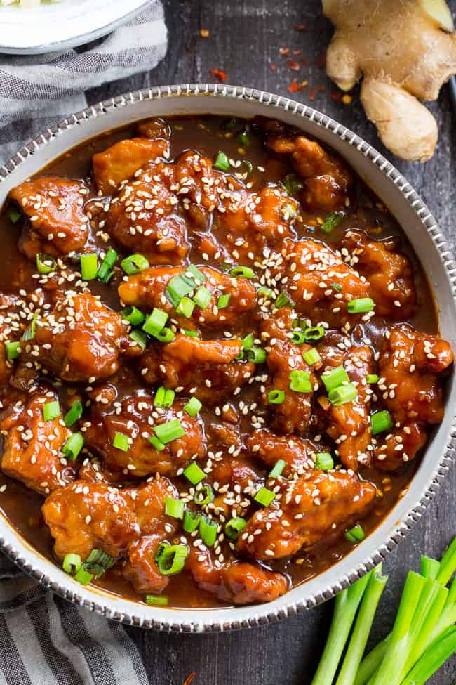 This paleo General Tso's Chicken is made in the Instant Pot in under 30 minutes!  Way better than takeout and just as fast, too, it's gluten-free, grain free, and free of refined sugar and soy.  Spicy and sweet, it's great served over cauliflower rice or with your favorite stir fried veggies!