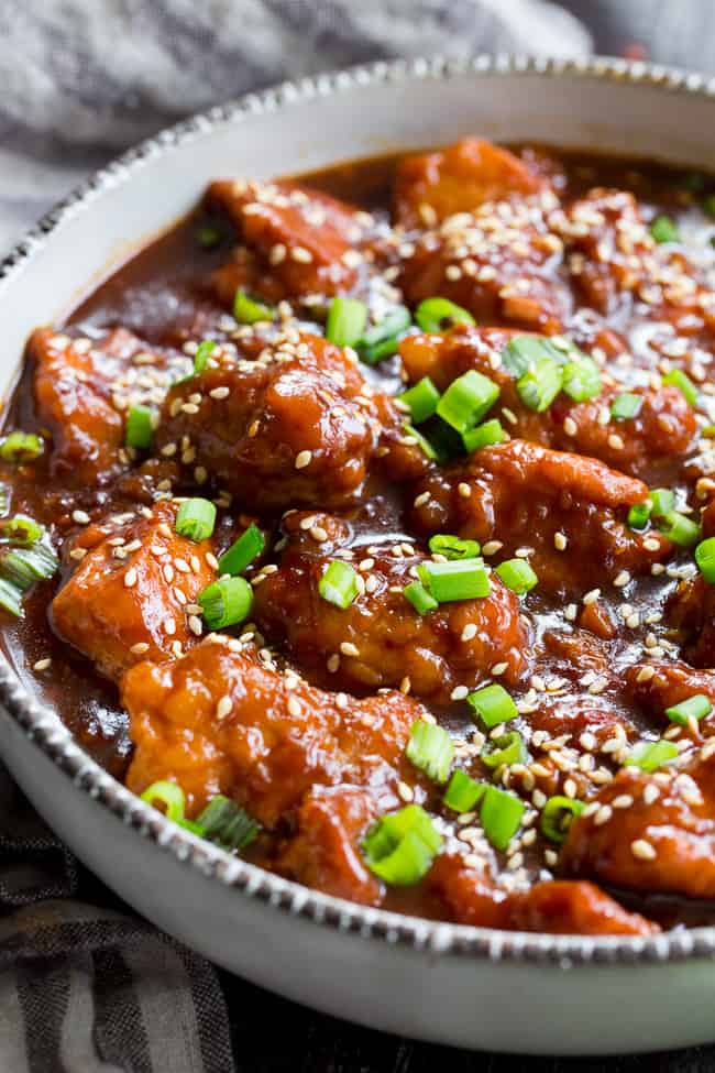 This paleo General Tso's Chicken is made in the Instant Pot in under 30 minutes!  Way better than takeout and just as fast, too, it's gluten-free, grain free, and free of refined sugar and soy.  Spicy and sweet, it's great served over cauliflower rice or with your favorite stir fried veggies!