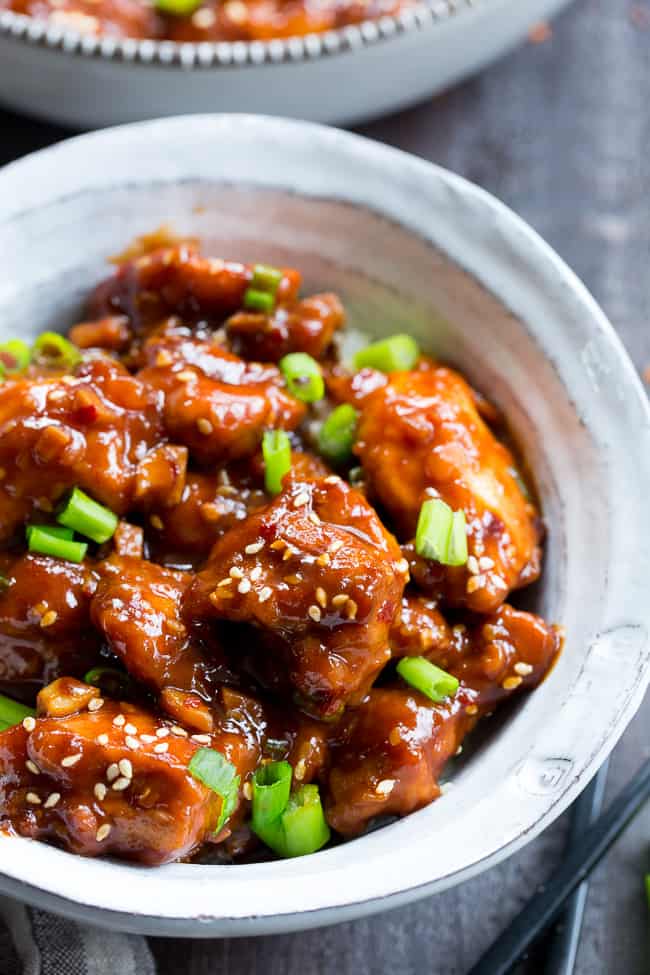 This paleo General Tso's Chicken is made in the Instant Pot in under 30 minutes!  Way better than takeout and just as fast, too, it's gluten-free, grain free, and free of refined sugar and soy.  Spicy and sweet, it's great served over cauliflower rice or with your favorite stir fried veggies!