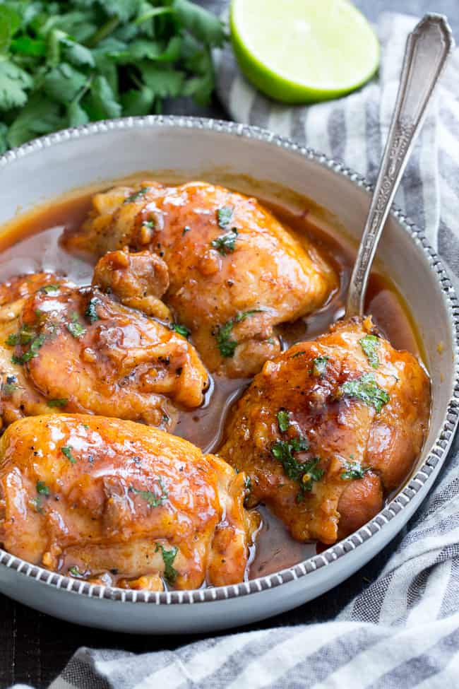 This garlic chipotle lime chicken is packed with tons of flavor and is incredibly easy to make in the Instant Pot!  The chicken is seared and pressure cooked in spicy/sweet sauce for a result that's sure to make everyone in your family happy!  Healthy, hearty, paleo friendly with a Whole30 option. 