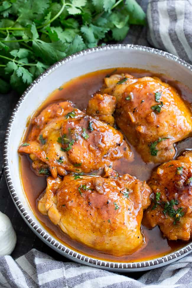 This garlic chipotle lime chicken is packed with tons of flavor and is incredibly easy to make in the Instant Pot!  The chicken is seared and pressure cooked in spicy/sweet sauce for a result that's sure to make everyone in your family happy!  Healthy, hearty, paleo friendly with a Whole30 option. 