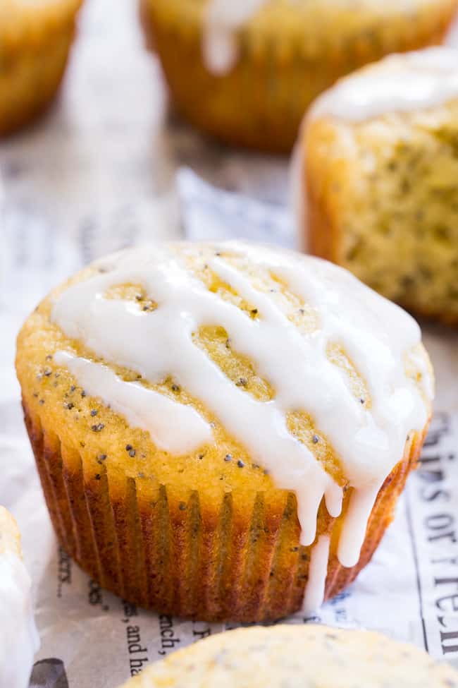 These Lemon Poppy Seed Muffins are tender, moist and full of sweet citrus flavor.  Drizzle them with a coconut glaze for a fun and tasty brunch treat or afternoon snack.  They're fast, easy, grain free, dairy free, paleo, and family approved!