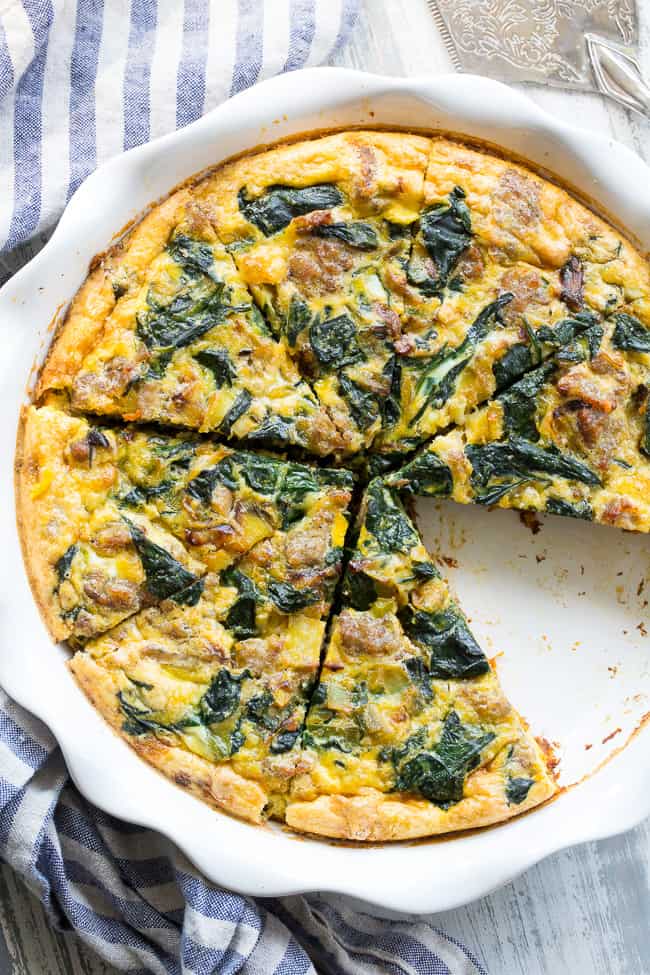 This sausage, leek and spinach quiche is packed with all your favorites for tons of flavor!   It starts with an easy sweet potato crust that's topped with savory sausage, leeks and spinach in a creamy dairy-free egg mixture, then baked to perfection.  Great for brunches or as a make-ahead breakfast, this quiche is Paleo and Whole30 compliant too! 