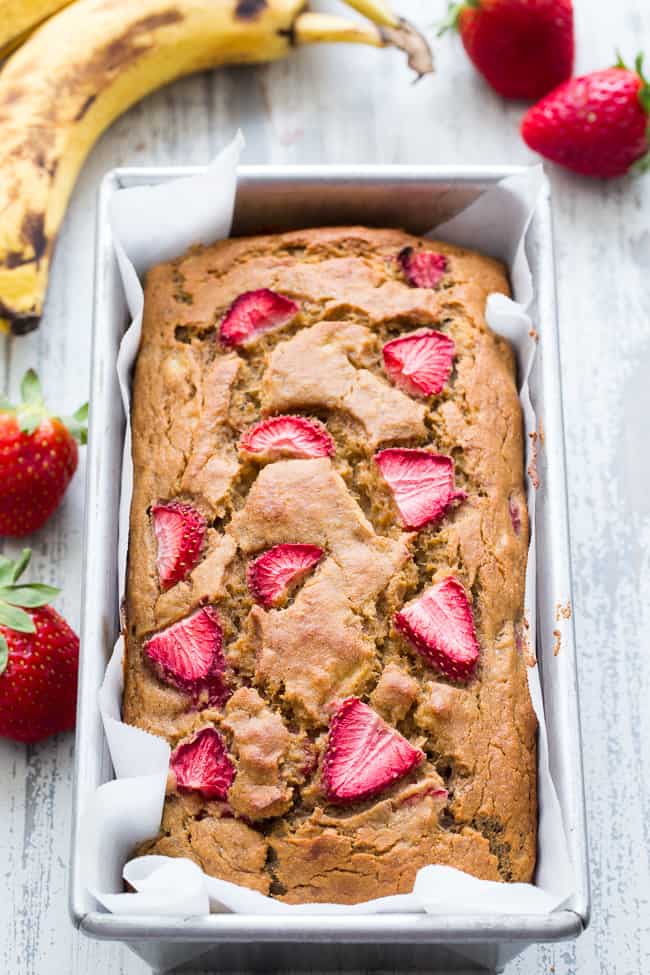 Strawberry Banana Bread that's hearty and soft with just enough sweetness, made both Paleo and nut free thanks to cassava flour!   The strawberries add sweet berry flavor without overwhelming the bread, making it perfect to go with breakfast or as a grab and go snack!  Gluten-free, dairy-free, grain free, paleo. 