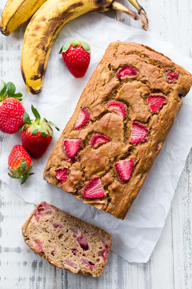 Strawberry Banana Bread that's hearty and soft with just enough sweetness, made both Paleo and nut free thanks to cassava flour!   The strawberries add sweet berry flavor without overwhelming the bread, making it perfect to go with breakfast or as a grab and go snack!  Gluten-free, dairy-free, grain free, paleo. 