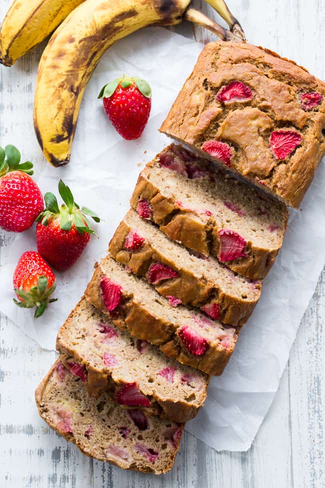 Strawberry Banana Bread that's hearty and soft with just enough sweetness, made both Paleo and nut free thanks to cassava flour!   The strawberries add sweet berry flavor without overwhelming the bread, making it perfect to go with breakfast or as a grab and go snack!  Gluten-free, dairy-free, grain free, paleo. 