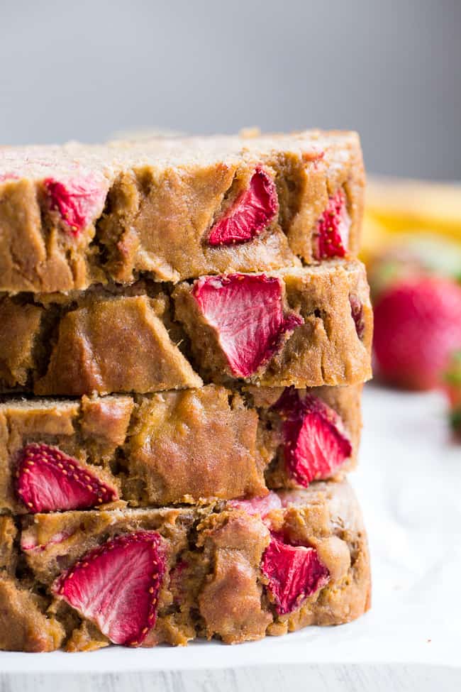 Strawberry Banana Bread that's hearty and soft with just enough sweetness, made both Paleo and nut free thanks to cassava flour!   The strawberries add sweet berry flavor without overwhelming the bread, making it perfect to go with breakfast or as a grab and go snack!  Gluten-free, dairy-free, grain free, paleo. 