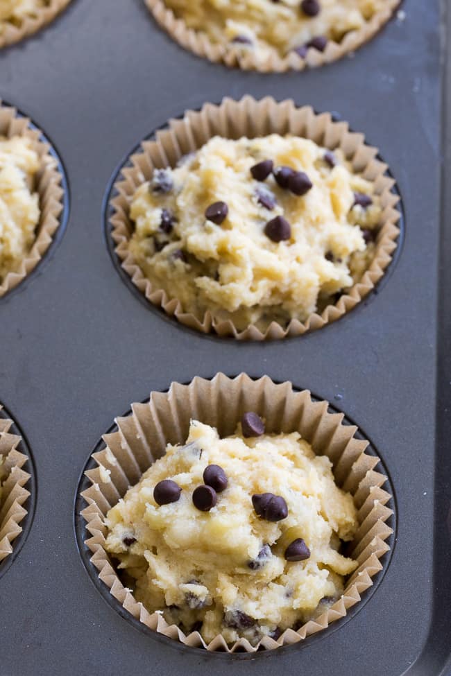 These moist and hearty chocolate chip banana muffins have perfect flavor and texture, PLUS are made nut-free thanks to coconut butter!  These kid friendly, easy-to-make paleo muffins will become a go-to recipe in your house since they're perfect for breakfast, snack and dessert!