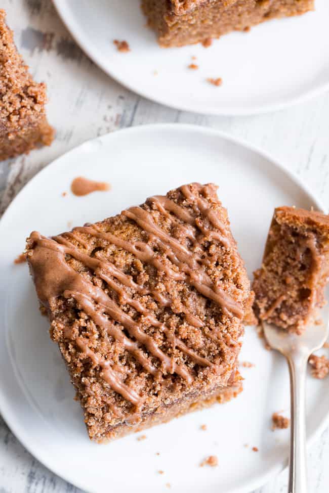 This classic cinnamon coffee cake has it all - a deliciously light, sweet, moist cake topped with loads of cinnamon crumbs and even an optional cinnamon icing!  It's paleo, gluten-free, dairy-free, kid approved and perfect for brunches, snacks and dessert.