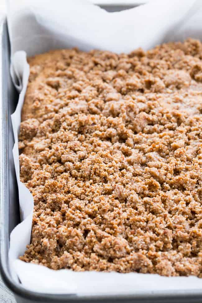 This classic cinnamon coffee cake has it all - a deliciously light, sweet, moist cake topped with loads of cinnamon crumbs and even an optional cinnamon icing!  It's paleo, gluten-free, dairy-free, kid approved and perfect for brunches, snacks and dessert.