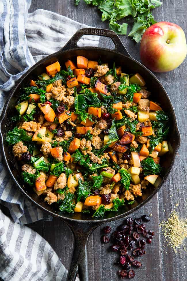 This sweet potato paleo breakfast hash is loaded with flavor, filling, nourishing, with the perfect sweet/savory balance.   Pan fried sweet potatoes are cooked with seasoned ground meat, greens, apples and cranberries for a delicious Whole30 and Paleo breakfast without the eggs! 