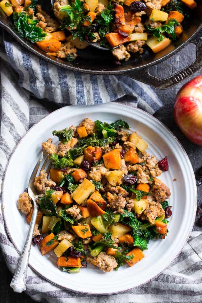 This sweet potato paleo breakfast hash is loaded with flavor, filling, nourishing, with the perfect sweet/savory balance.   Pan fried sweet potatoes are cooked with seasoned ground meat, greens, apples and cranberries for a delicious Whole30 and Paleo breakfast without the eggs! 