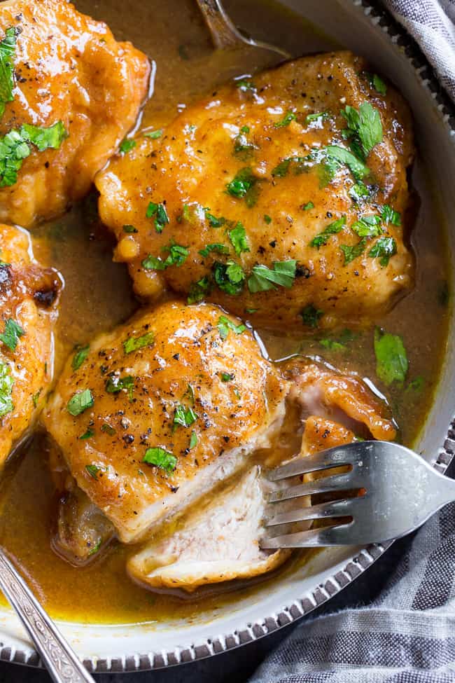 This paleo honey mustard chicken comes together in just 30 minutes in the Instant Pot!  Skin-on chicken thighs are perfectly cooked in a sauce that's packed with tons of sweet tangy flavor.  There's even a Whole30 friendly option using dates instead of honey to sweeten the sauce!  Family approved and sure to become a dinner favorite.