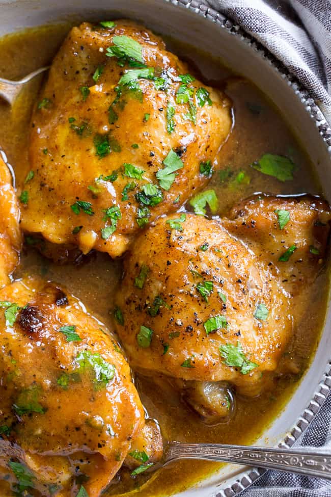 This paleo honey mustard chicken comes together in just 30 minutes in the Instant Pot!  Skin-on chicken thighs are perfectly cooked in a sauce that's packed with tons of sweet tangy flavor.  There's even a Whole30 friendly option using dates instead of honey to sweeten the sauce!  Family approved and sure to become a dinner favorite.