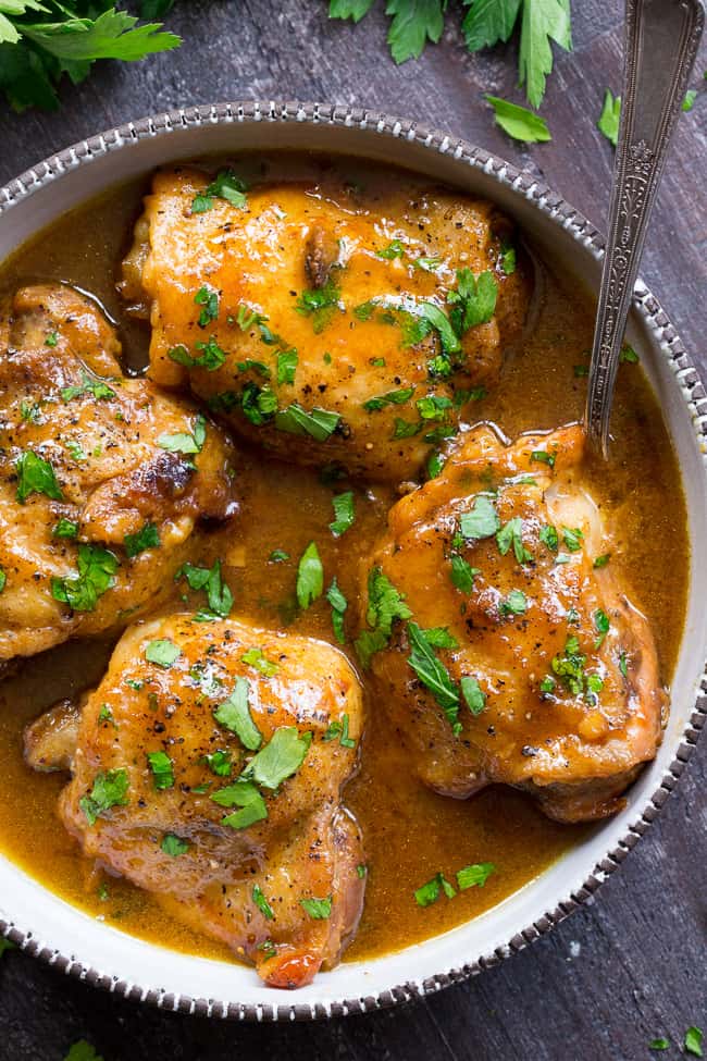 This paleo honey mustard chicken comes together in just 30 minutes in the Instant Pot!  Skin-on chicken thighs are perfectly cooked in a sauce that's packed with tons of sweet tangy flavor.  There's even a Whole30 friendly option using dates instead of honey to sweeten the sauce!  Family approved and sure to become a dinner favorite.