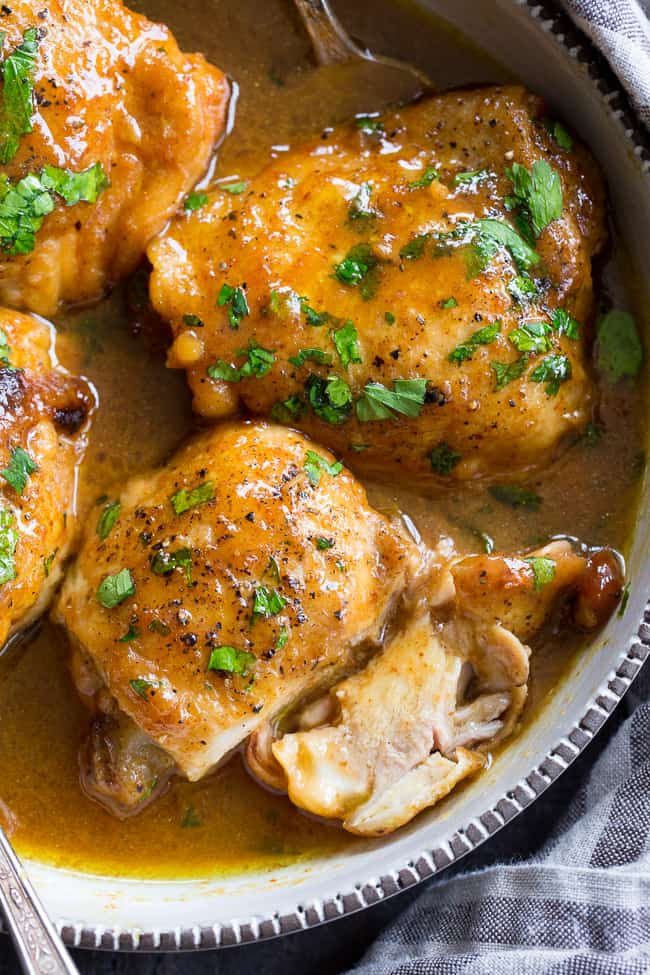 This paleo honey mustard chicken comes together in just 30 minutes in the Instant Pot!  Skin-on chicken thighs are perfectly cooked in a sauce that's packed with tons of sweet tangy flavor.  There's even a Whole30 friendly option using dates instead of honey to sweeten the sauce!  Family approved and sure to become a dinner favorite.