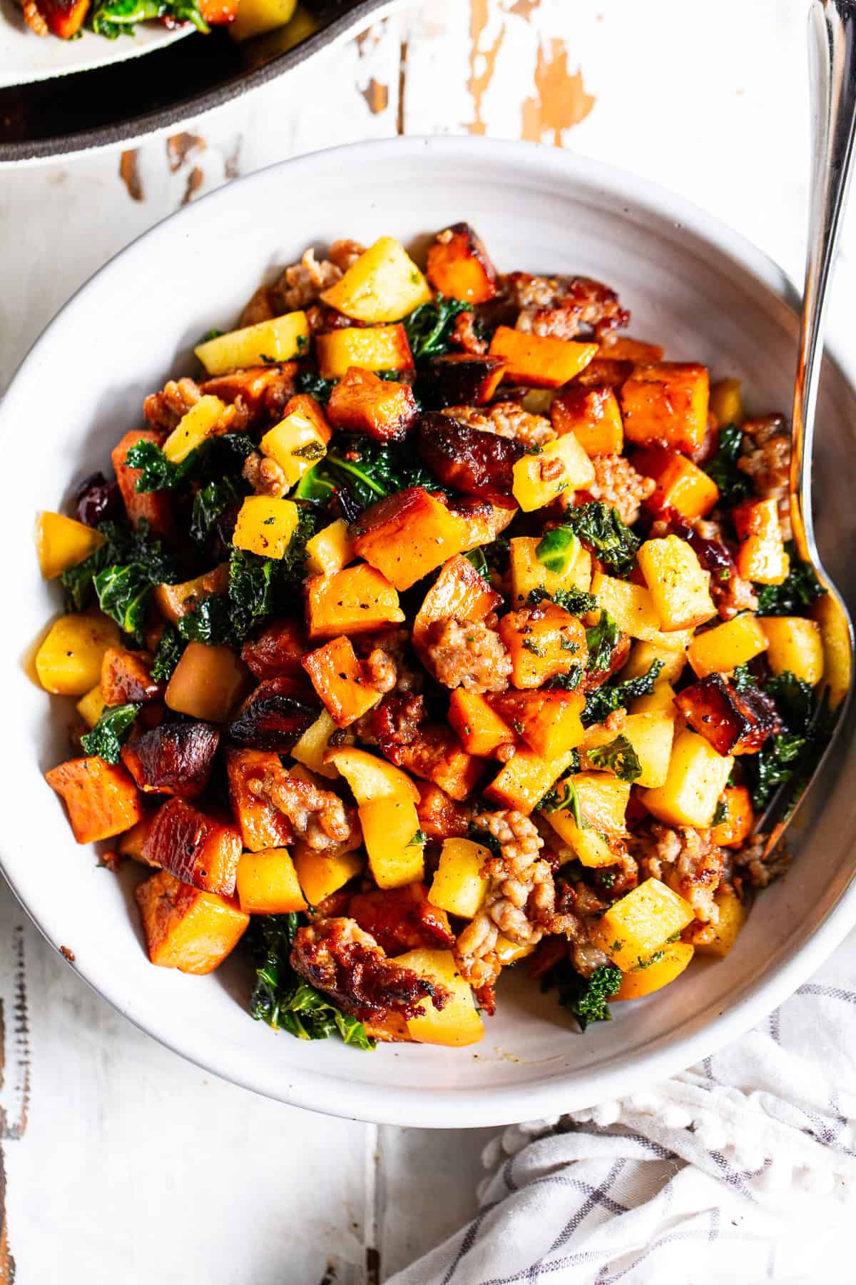 paleo breakfast hash with sweet potatoes sausage apples and kale