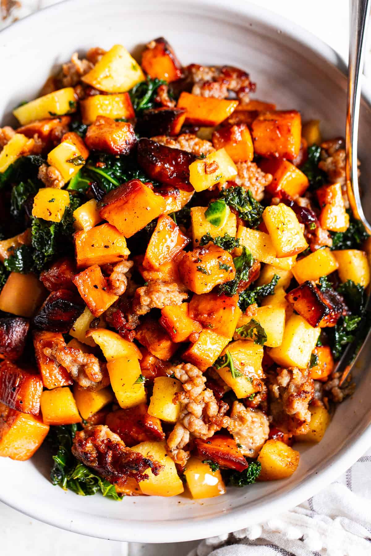 paleo breakfast hash with sweet potatoes sausage apples and kale