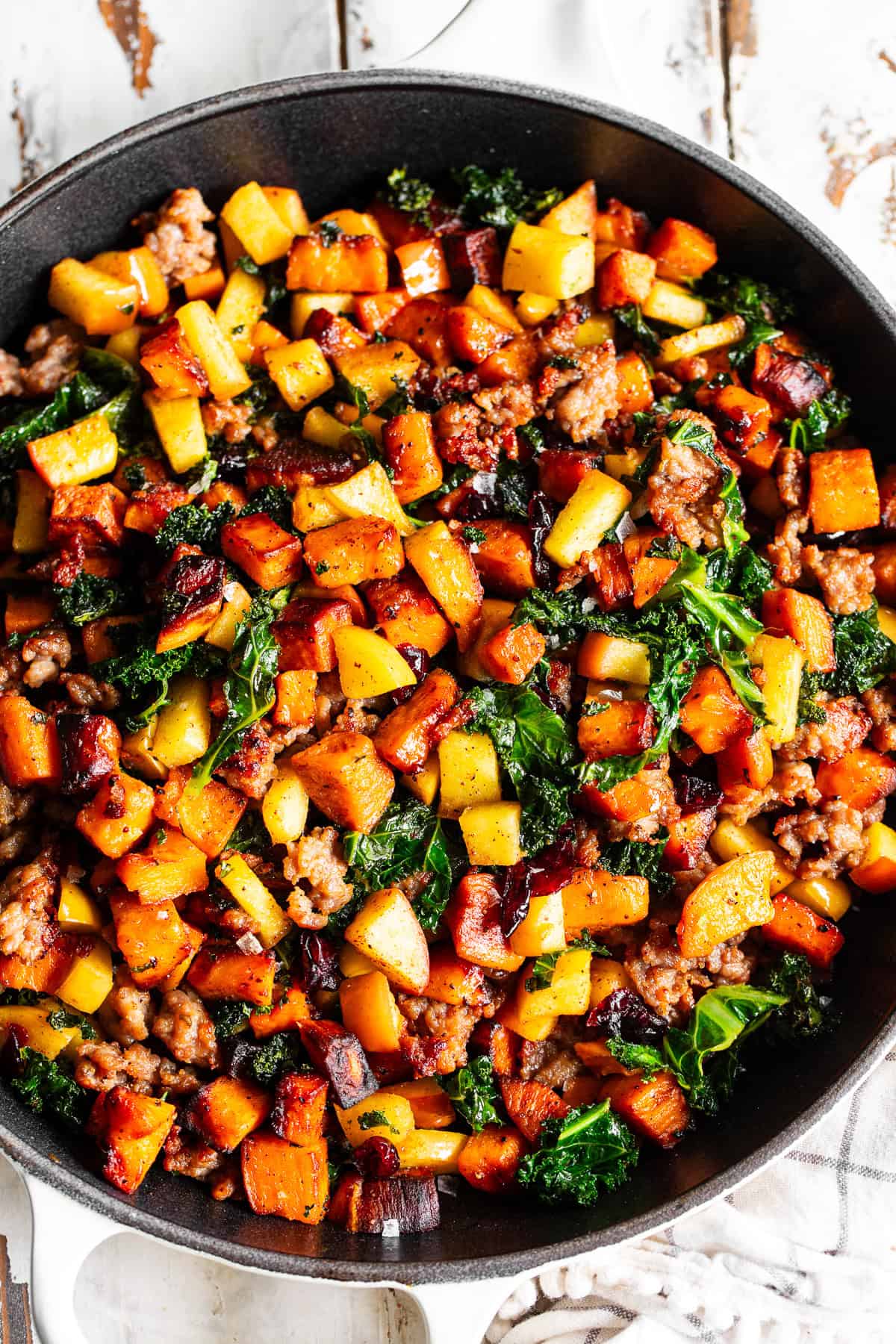 paleo breakfast hash with sweet potatoes sausage apples and kale