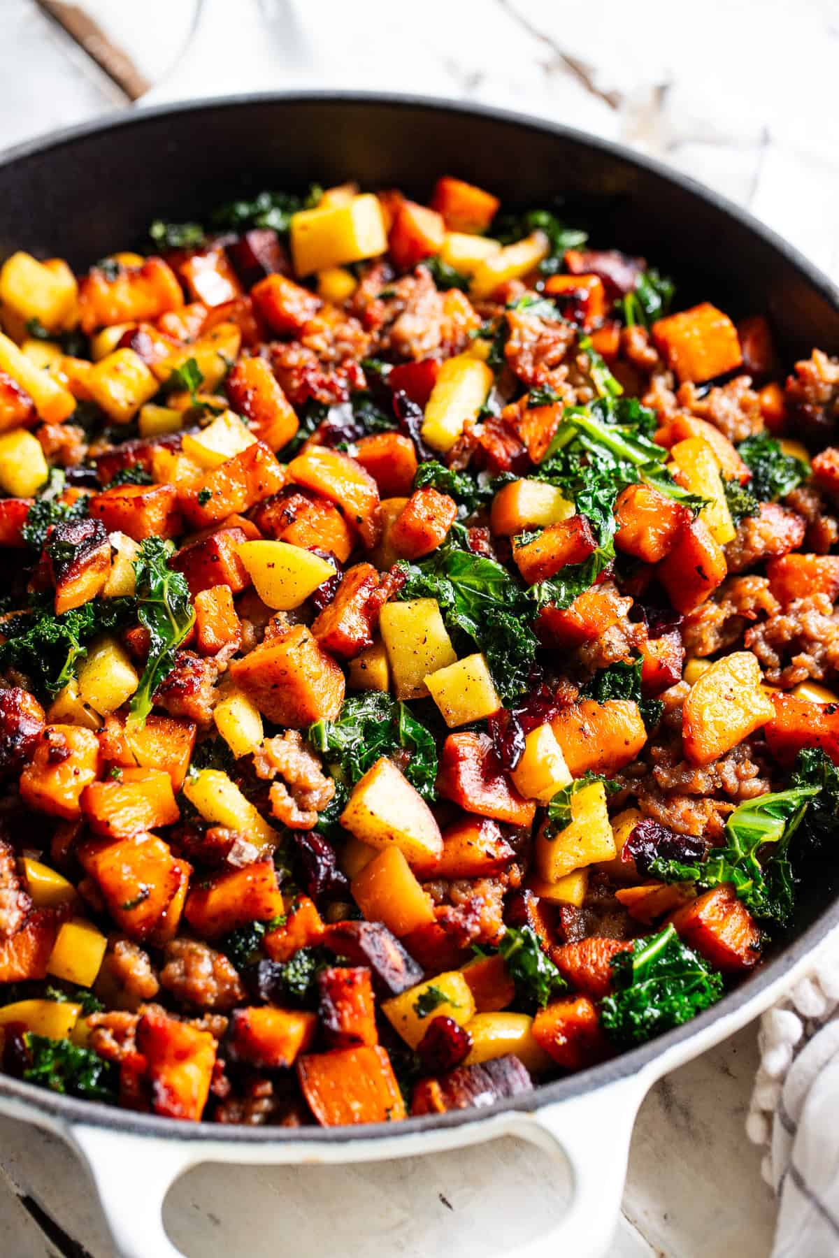 paleo breakfast hash with sweet potatoes sausage apples and kale