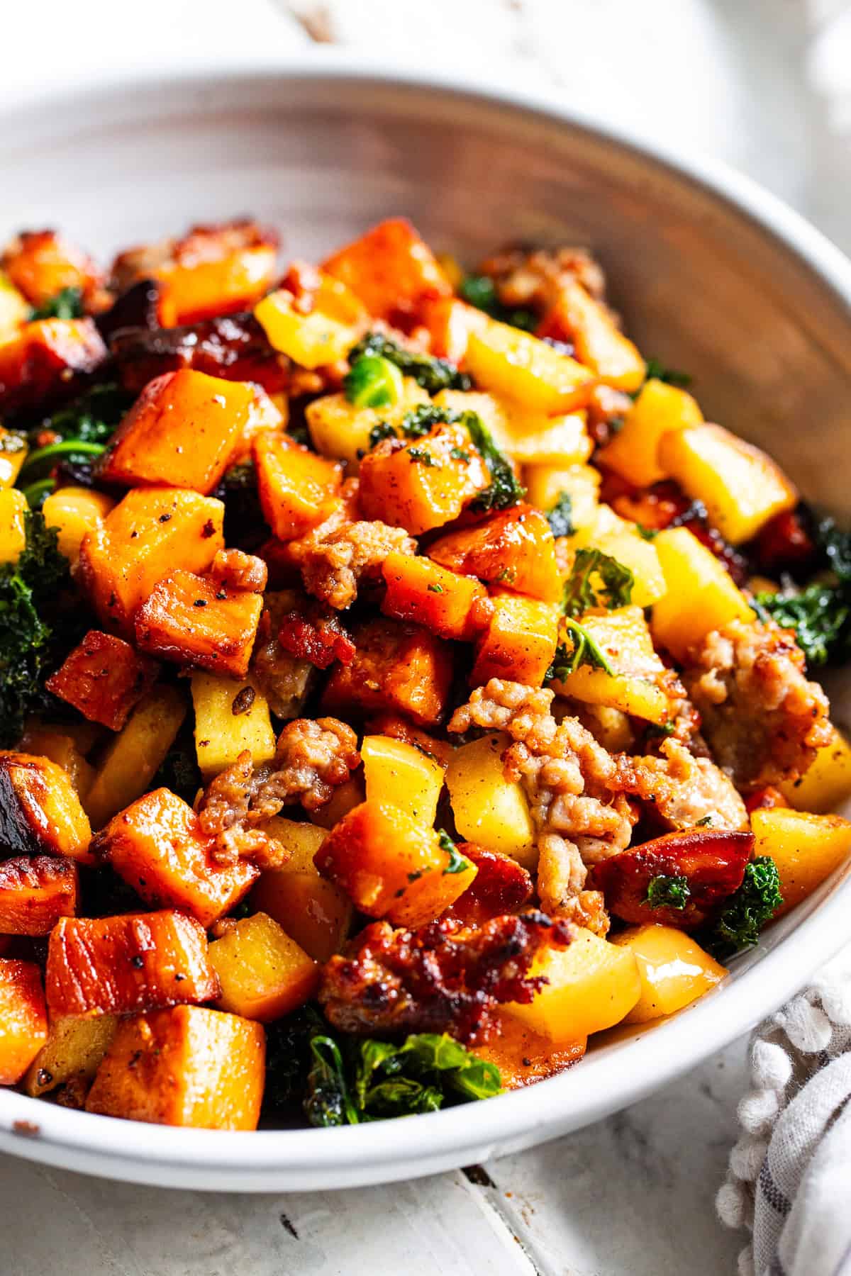 paleo breakfast hash with sweet potatoes sausage apples and kale