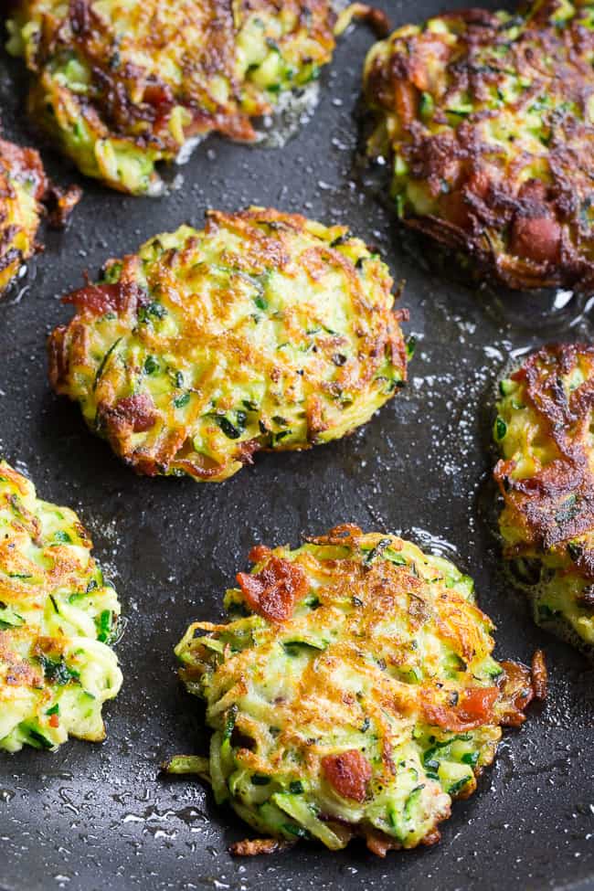 These savory bacon zucchini fritters are easy to make, packed with veggies and downright addicting!  They're delicious served as a side dish or appetizer with homemade ranch dip.  These tasty fritters are also paleo, Whole30 friendly, gluten free and dairy free.