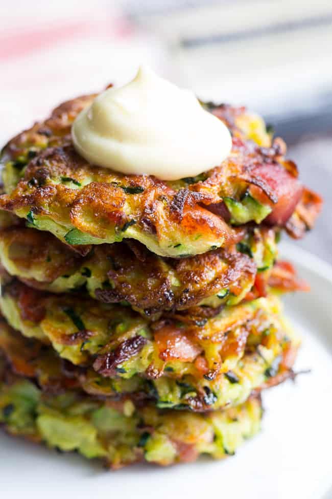 These savory bacon zucchini fritters are easy to make, packed with veggies and downright addicting!  They're delicious served as a side dish or appetizer with homemade ranch dip.  These tasty fritters are also paleo, Whole30 friendly, gluten free and dairy free.