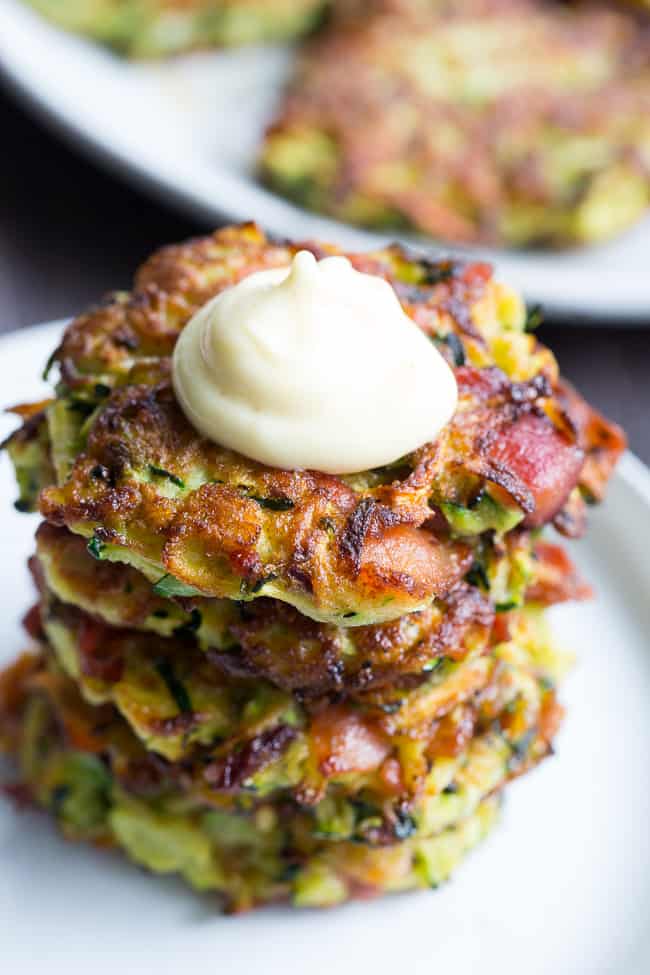 These savory bacon zucchini fritters are easy to make, packed with veggies and downright addicting!  They're delicious served as a side dish or appetizer with homemade ranch dip.  These tasty fritters are also paleo, Whole30 friendly, gluten free and dairy free.
