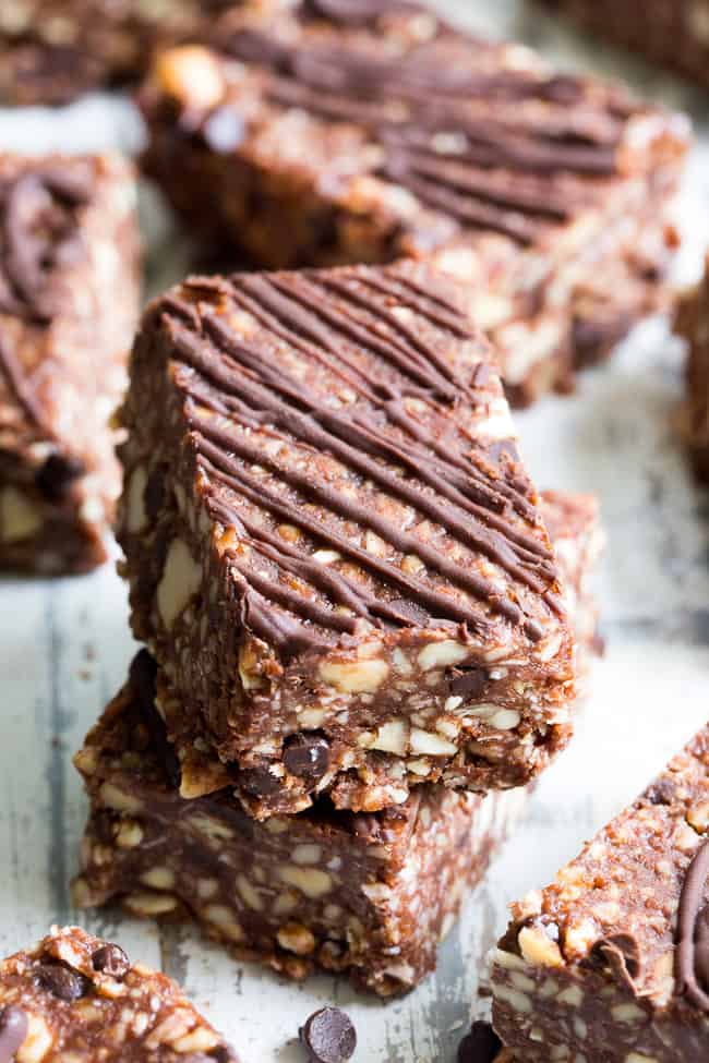 Chewy, crunchy, and packed with chocolate flavor, these paleo, no-bake grain free granola bars are going to become your favorite with the first bite! They're loaded with healthy fats from coconut and nuts and have a lightly sweetened, rich dark chocolate flavor. Kid approved, gluten-free, dairy-free, vegan, grain free and addicting!