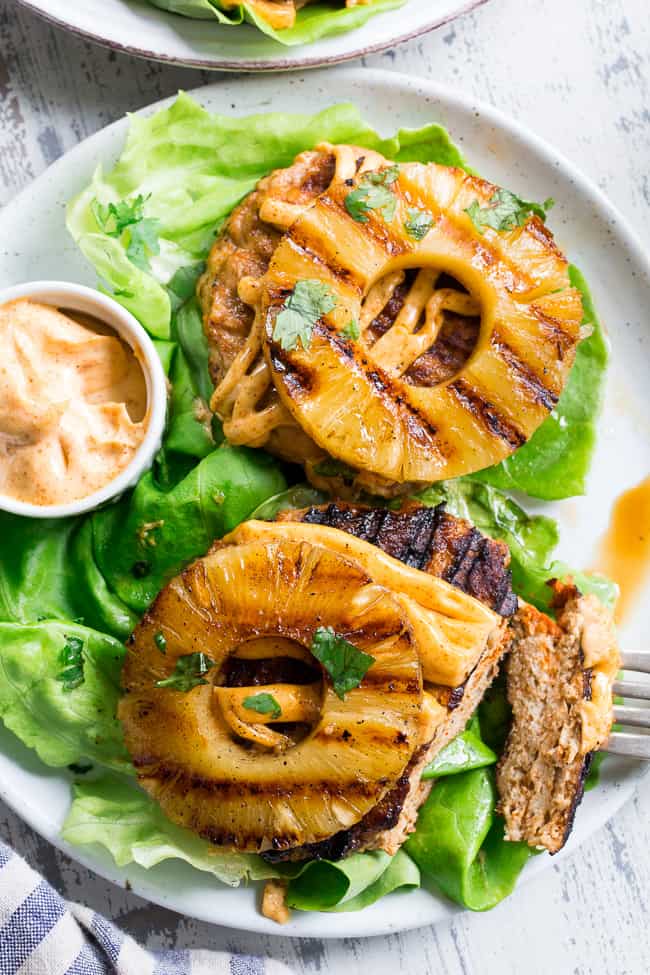 These spicy Hawaiian Chicken Burgers are super quick to make, packed with flavor and Whole30 compliant!  Serve in butter lettuce wraps topped with plenty of chipotle ranch for an easy weeknight dinner.  Perfect for grilling season or anytime!