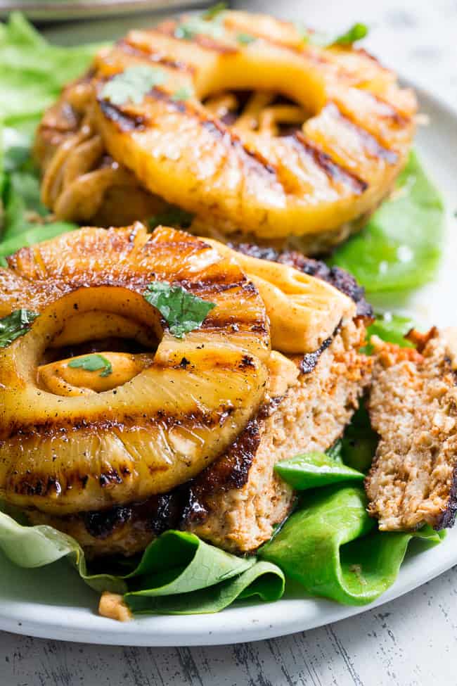 These spicy Hawaiian Chicken Burgers are super quick to make, packed with flavor and Whole30 compliant!  Serve in butter lettuce wraps topped with plenty of chipotle ranch for an easy weeknight dinner.  Perfect for grilling season or anytime!