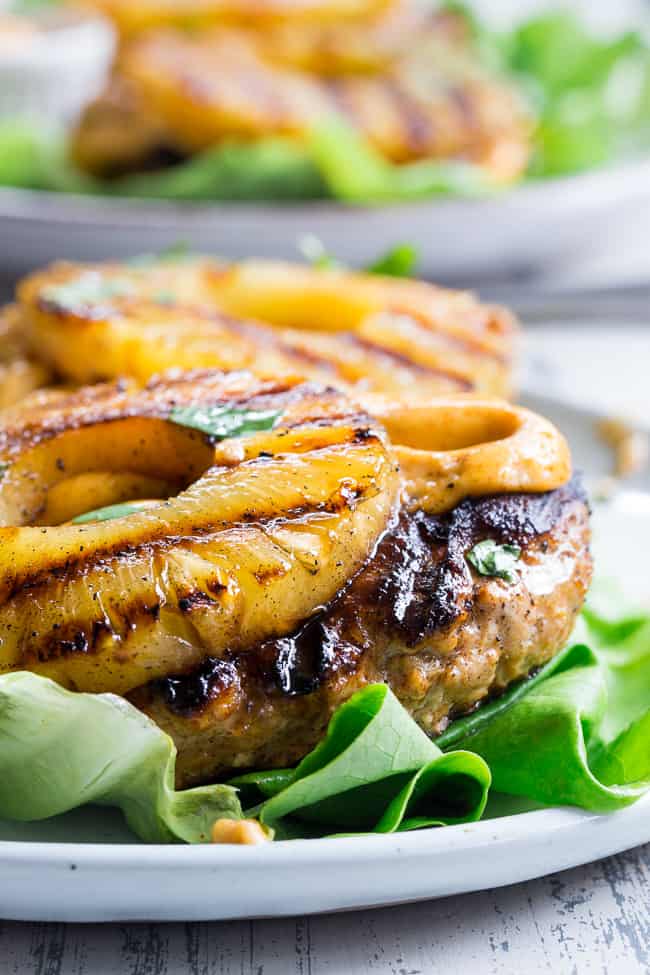 These spicy Hawaiian Chicken Burgers are super quick to make, packed with flavor and Whole30 compliant!  Serve in butter lettuce wraps topped with plenty of chipotle ranch for an easy weeknight dinner.  Perfect for grilling season or anytime!