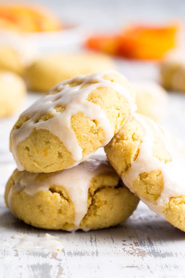 These paleo orange coconut cookies have a soft shortbread-like texture and tons of sweet citrus flavor!   They're made with coconut butter and coconut flour, so they're grain free, gluten free, dairy free and nut free.  These addicting cookies are kid approved and delicious with a coconut maple icing!