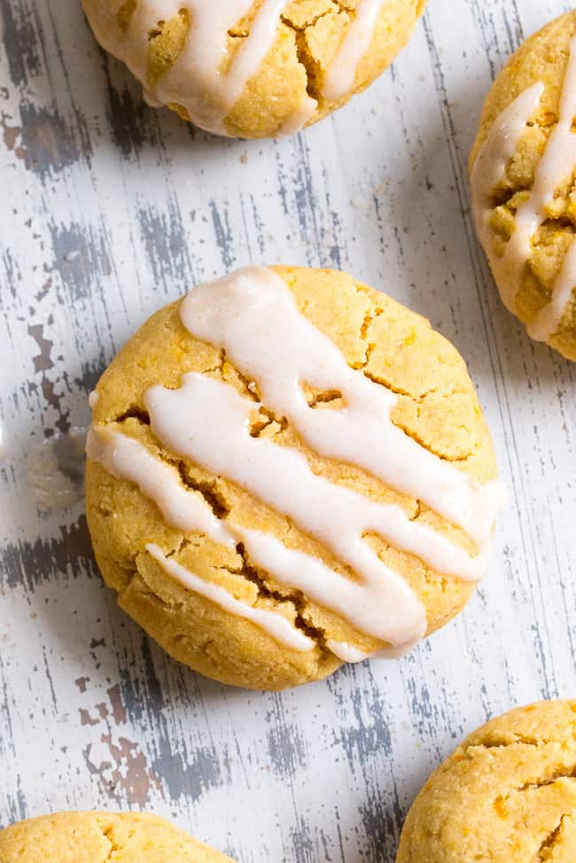 These paleo orange coconut butter cookies have a soft shortbread-like texture and tons of sweet citrus flavor!   They're made with coconut butter and coconut flour, so they're grain free, gluten free, dairy free and nut free.  These addicting cookies are kid approved and delicious with a coconut maple icing!