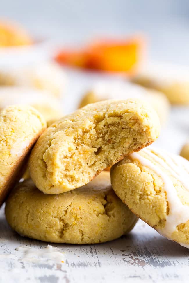 These paleo orange coconut butter cookies have a soft shortbread-like texture and tons of sweet citrus flavor!   They're made with coconut butter and coconut flour, so they're grain free, gluten free, dairy free and nut free.  These addicting cookies are kid approved and delicious with a coconut maple icing!