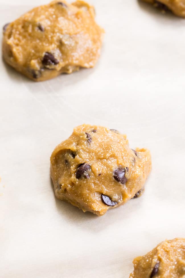 These big soft paleo chocolate chip cookies have the perfect chewy texture with a great nutty flavor thanks to tahini.  They're dairy-free, gluten-free, grain free and nut free as well.  Perfect for snacks and desserts, these cookies are thick and decadent yet healthy!