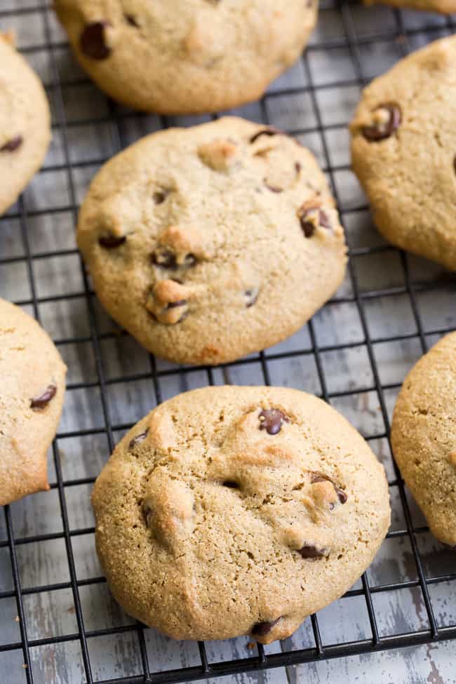 These big soft paleo chocolate chip cookies have the perfect chewy texture with a great nutty flavor thanks to tahini.  They're dairy-free, gluten-free, grain free and nut free as well.  Perfect for snacks and desserts, these cookies are thick and decadent yet healthy!