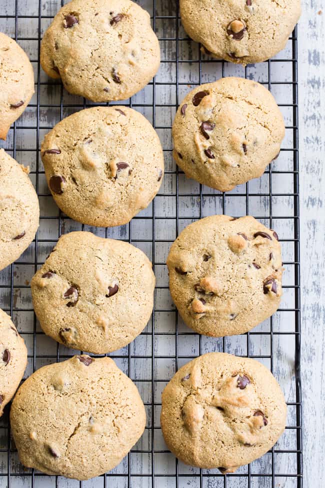 These big soft paleo chocolate chip cookies have the perfect chewy texture with a great nutty flavor thanks to tahini.  They're dairy-free, gluten-free, grain free and nut free as well.  Perfect for snacks and desserts, these cookies are thick and decadent yet healthy!