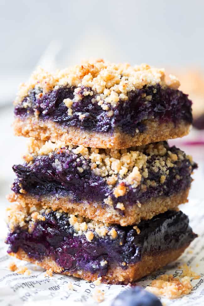 These paleo and vegan blueberry crumb bars are gooey sweet and totally addicting! They’re a great treat to have around for a heathy snack or dessert. Easy to make, gluten-free, grain free, vegan, and total comfort food!