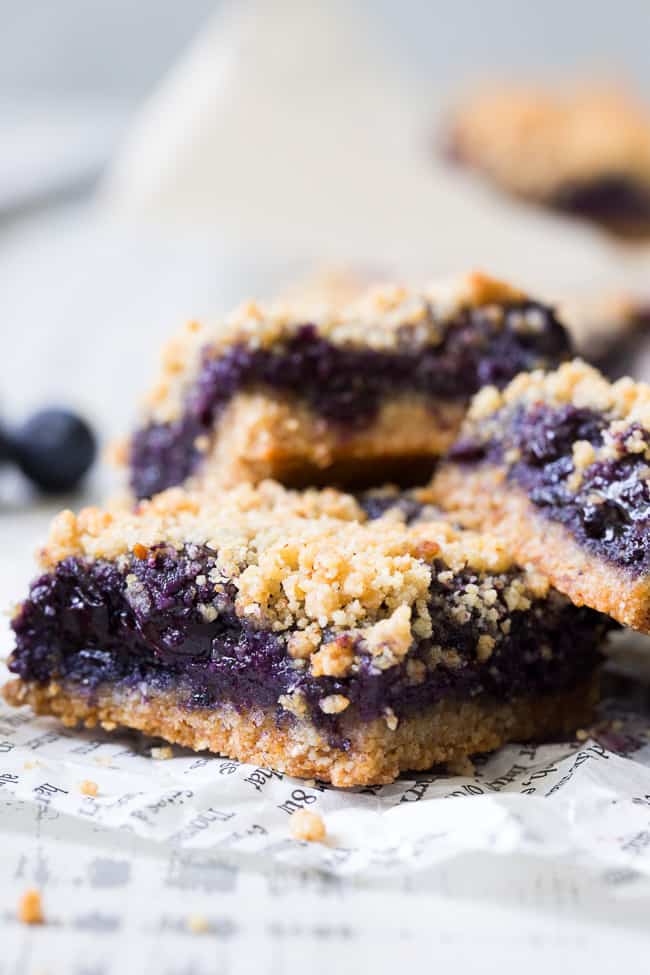 These paleo and vegan blueberry crumb bars are gooey sweet and totally addicting! They’re a great treat to have around for a heathy snack or dessert. Easy to make, gluten-free, grain free, vegan, and total comfort food!