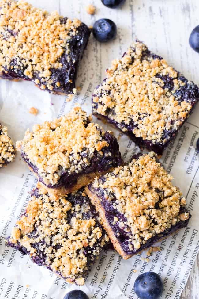 These paleo and vegan blueberry crumb bars are gooey sweet and totally addicting! They’re a great treat to have around for a heathy snack or dessert. Easy to make, gluten-free, grain free, vegan, and total comfort food!