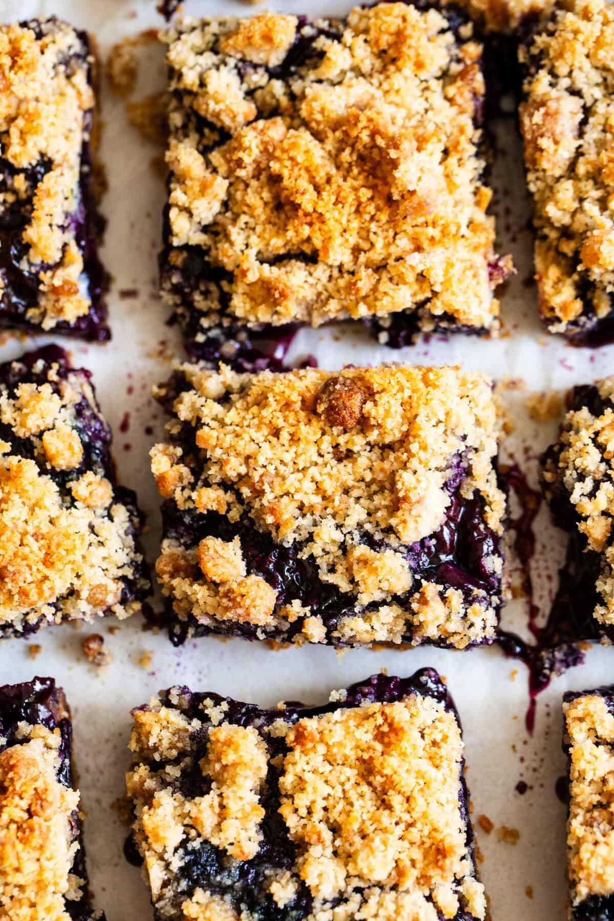 overhead shot of blueberry crumble bars with almond flour crust and jammy filling