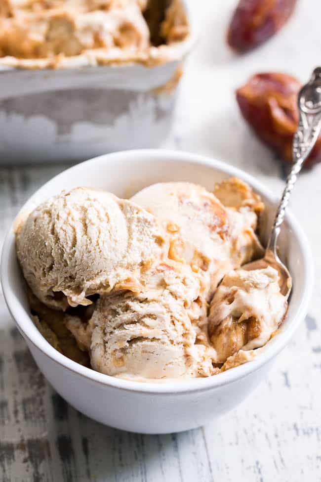 This salted caramel ice cream is easy to make, dairy-free, paleo, vegan, healthy, and so incredibly tasty!  A simple vegan salted caramel made from dates is swirled into a cashew-coconut based homemade ice cream that's creamy right out of the freezer.  Add it to your list of must-try healthy ice cream recipes ASAP!