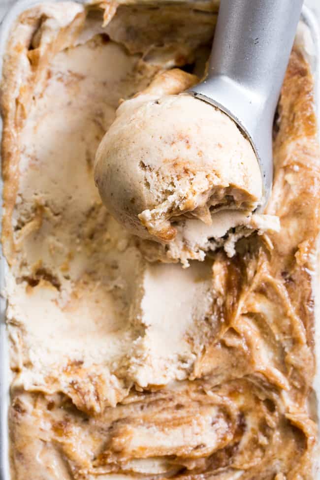 This salted caramel ice cream is easy to make, dairy-free, paleo, vegan, healthy, and so incredibly tasty!  A simple vegan salted caramel made from dates is swirled into a cashew-coconut based homemade ice cream that's creamy right out of the freezer.  Add it to your list of must-try healthy ice cream recipes ASAP!